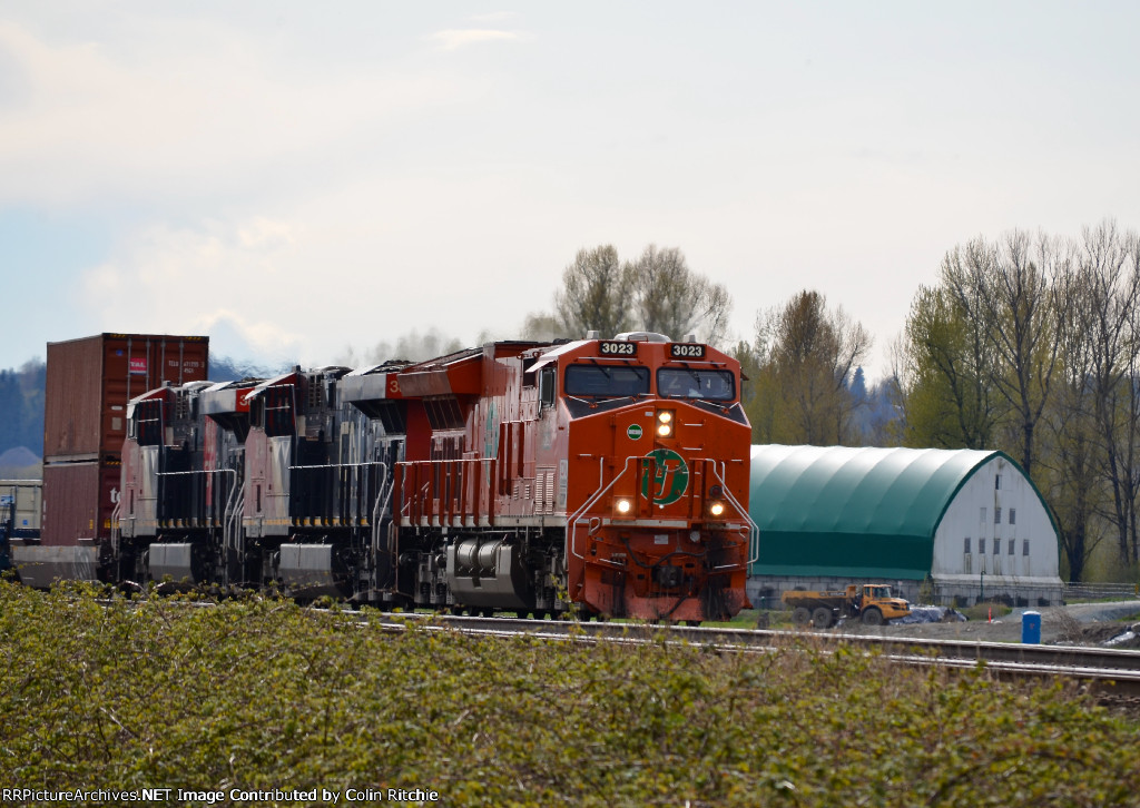 The "J", CN 3023 Heritage unit leading a unit stack train E/B through the CP Page Sub turnout just east of the Sorenson Road crossing